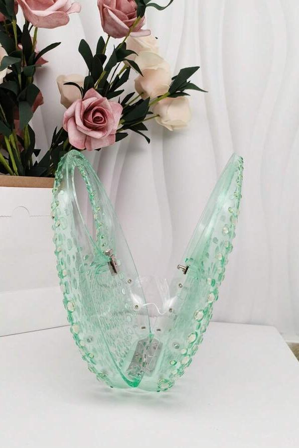 Clutch aus Acryl mit Strassverzierung